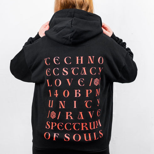 "Unity" Ultra Heavy Hoodie in schwarz von Technostoff, Rückansicht, getragen von Raver Girl
