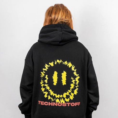 "Felicimo" Ultra Heavy Hoodie in schwarz von Technostoff, Rückansicht, getragen von Raver Girl
