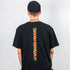 Being Human Stripe oversized T-Shirt in schwarz, getragen von einem Raver, Foto von hinten