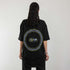 schwarzes oversized "Techno Tribe Circle" Raver T-Shirt von hinten, getragen von einer Frau