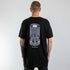 schwarzes oversized "Beyond Sound" Raver T-Shirt von hinten, getragen von einem Mann