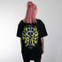 schwarzes oversized "Technostoff Tribe" Raver T-Shirt von hinten, getragen von einer Frau