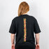 Being Human Stripe oversized T-Shirt in schwarz, getragen von einer Raver Frau, Foto von hinten