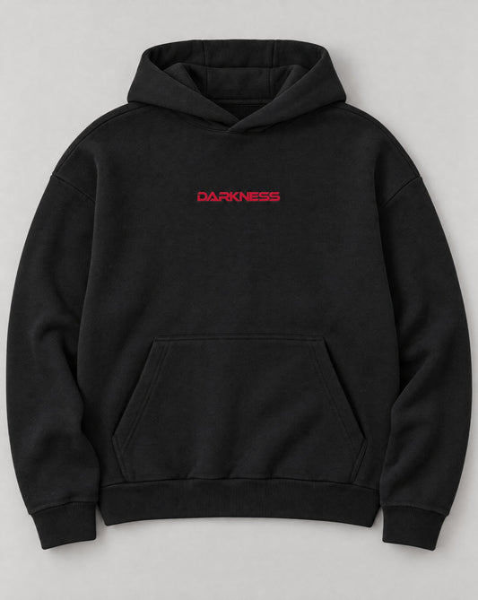 Technostoff DARKNESS Hoodie in Schwarz, oversized, mit rotem gesticktem DARKNESS-Schriftzug mittig auf der Brust, Kapuze, Känguru-Tasche und gerippten Bündchen, Flatlay Vorderseite auf hellgrauem Hintergrund