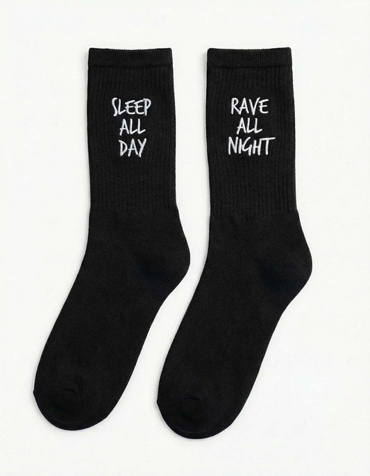 Black Technostoff Rave All Night Sleep All Day embroidered socks, pair lying from the front
