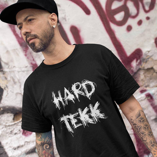 Raver wearing black Technostoff Scratched Hardtekk T-shirt in front of graffiti wall