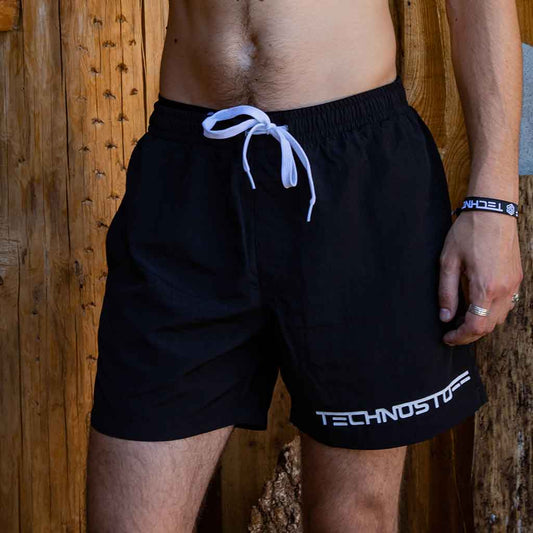 Technostoff Techno and Rave swim trunks on man in water, front view